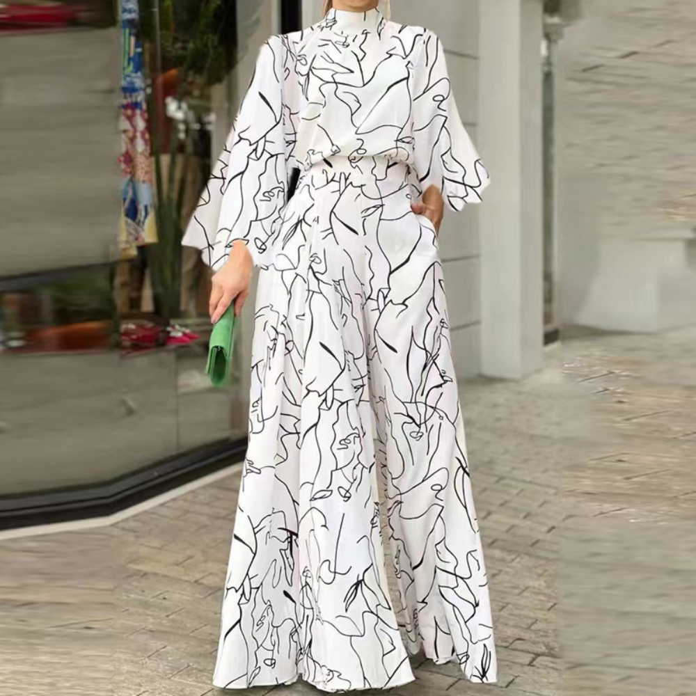 Celia - Eleganter Jumpsuit mit abstraktem Muster und langen Ärmeln