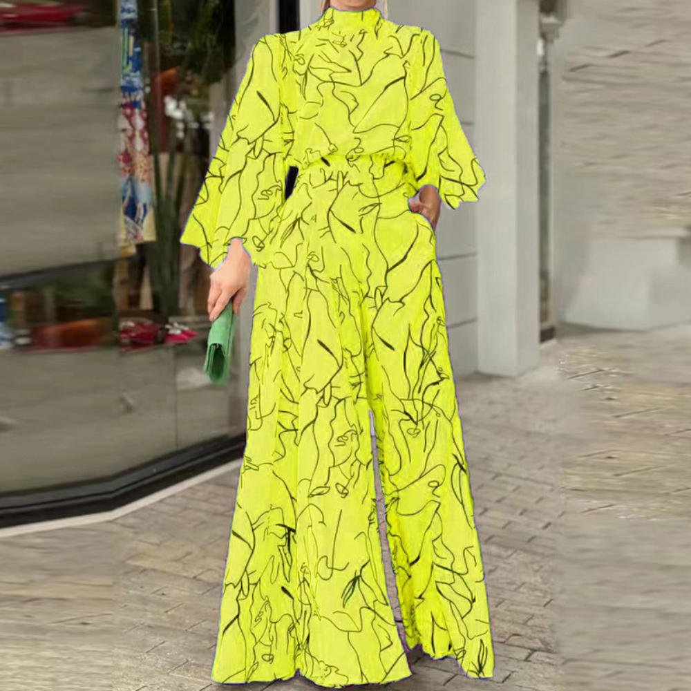 Celia - Eleganter Jumpsuit mit abstraktem Muster und langen Ärmeln